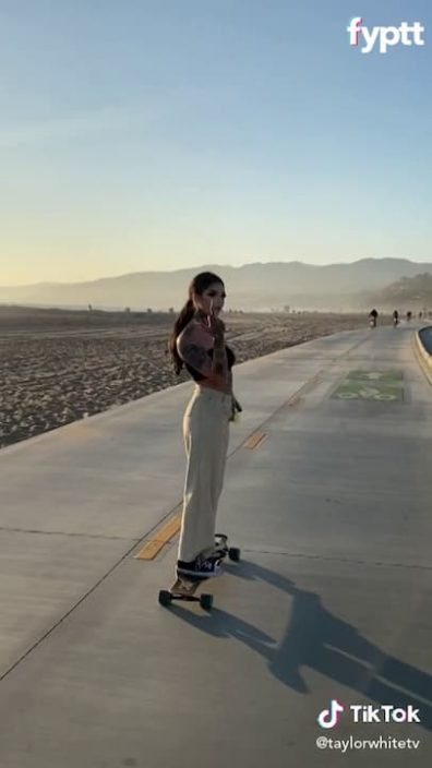 Tattoo TikTok thot flashes her tits in public on the beach