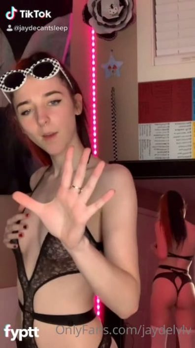 Young redhead dancing with sheer see through black lingerie on sexy TikTok showing pierced nipples