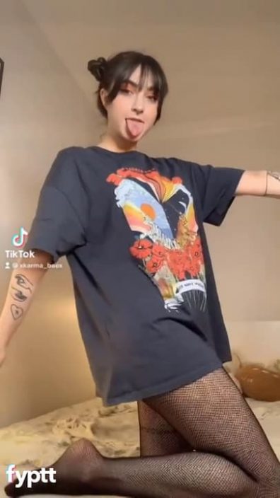 Hot bae tries naked Buss It challenge with over-sized tshirt and fishnets