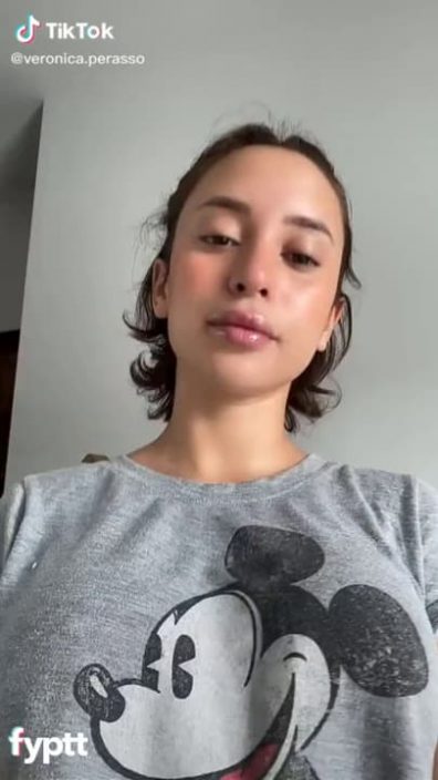 Short haired TikTok girl with big tiddies gets naked in then kitchen and fingers her pussy