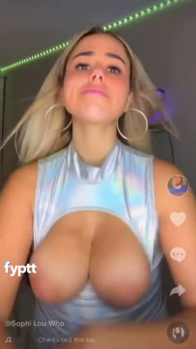 Apparently this sleeveless shirt can't handle her big TikTok tits