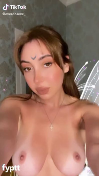Naked top fairy with tan lines on her boobs making NSFW TikTok