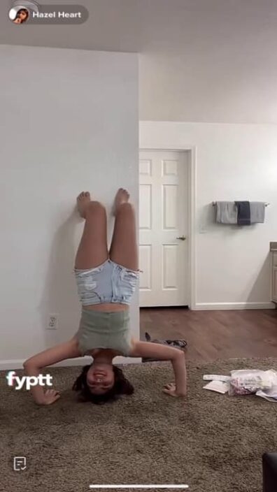 Pretty girl with big tits show nip slip on Live because of the handstand challenge