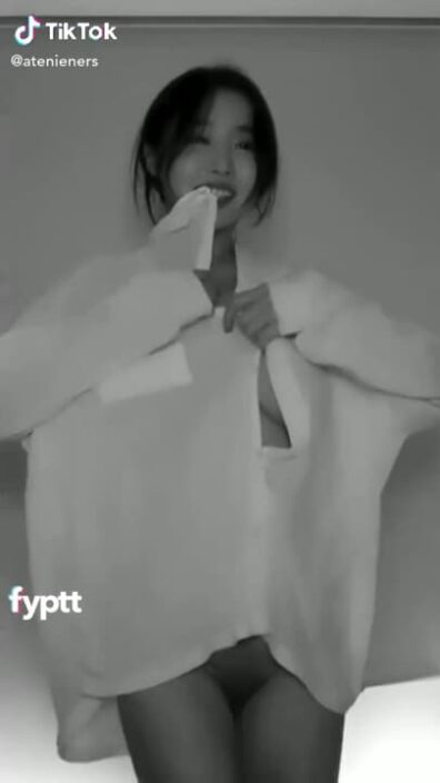 Beautiful korean with hot big natural tits doing a sexy TikTok dance while wearing a big white shirt