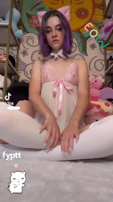 Cute cat cosplay girl doing sexy TikTok trend with a see through top