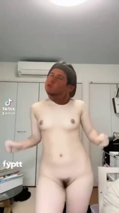 Nude TikTok girl dancing with a meme filter on her head