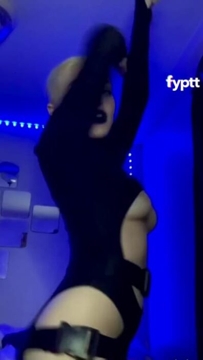 Goth girl dancing in a black suit and slowly revealing her TikTok tits