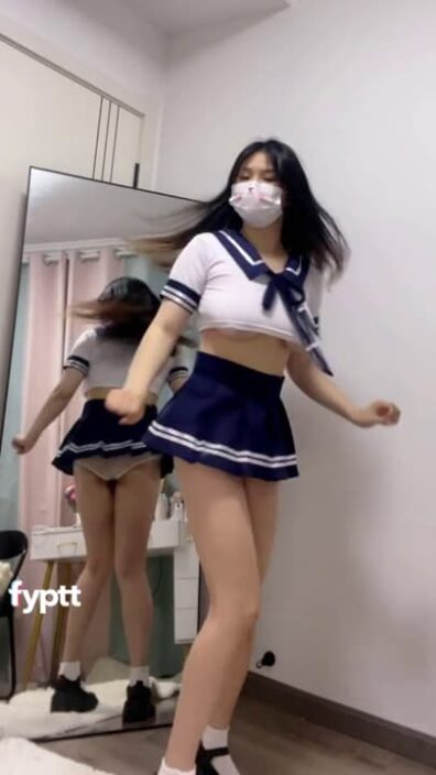 Busty Asian dancing in Japanese short skirt with her big boobs out