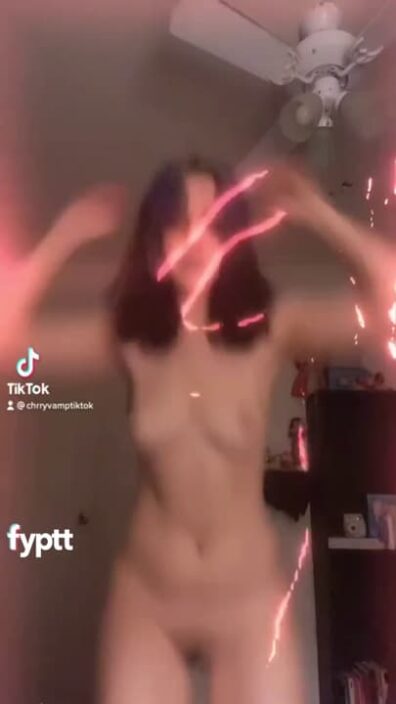 Slender naked girl dancing to hai phut hon song in cool light filter effect on tiktok