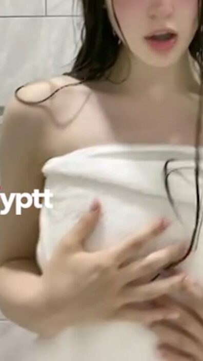 Babe's nipples slip out of towel while doing nsfw TikTok trend after taking a bath