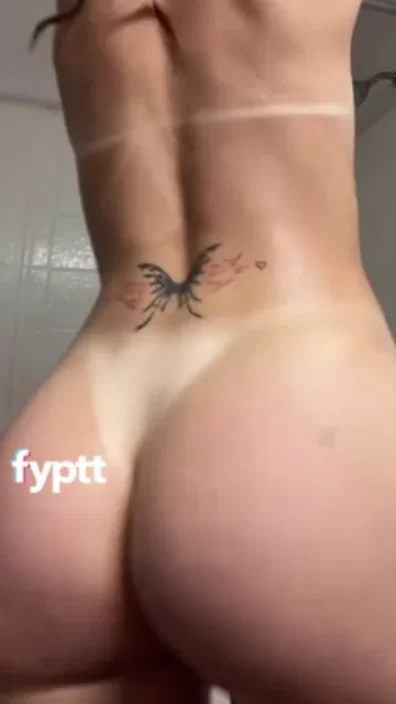 Shower twerk video of naked girl dancing with round ass jiggle as wet skin glistening in shower hits viral dance trend